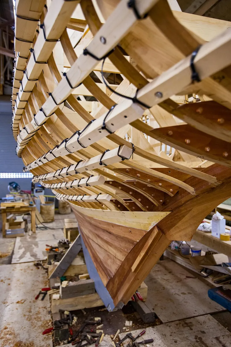 Slide: The Image of 1931 Sparkman & Stephens 36 Sloop under restoration, wooden frame structure in workshop. - 24