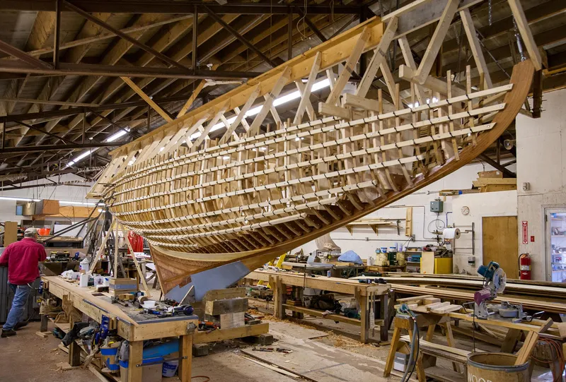 Slide: The Image of Restoration of a 1931 Sparkman & Stephens 36 Sloop in a workshop. - 25