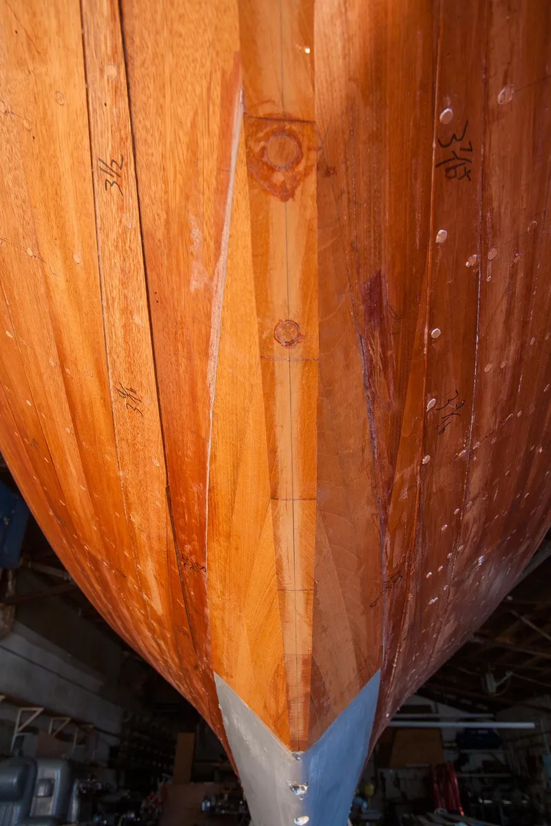Slide: The Image of Close-up of the wooden hull of a 1931 Sparkman & Stephens 36 Sloop. - 29