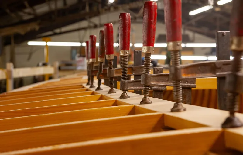 Slide: The Image of Woodworking on Sparkman & Stephens 36 Sloop, 1931 model, with clamps in workshop. - 39