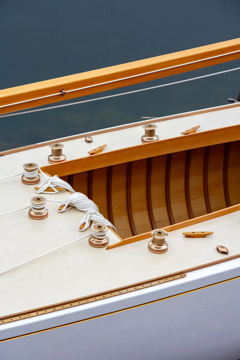 Slide: The Image of Close-up of 1931 Sparkman & Stephens 36 Sloop deck with polished wood and rope. - 9