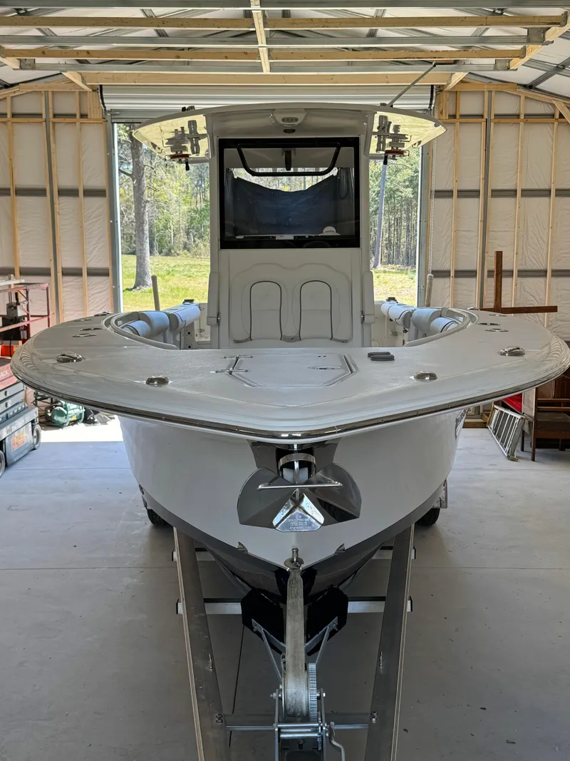 Slide: The Image of 2018 Sea Hunt Gamefish 30 boat in a garage, front view. - 20