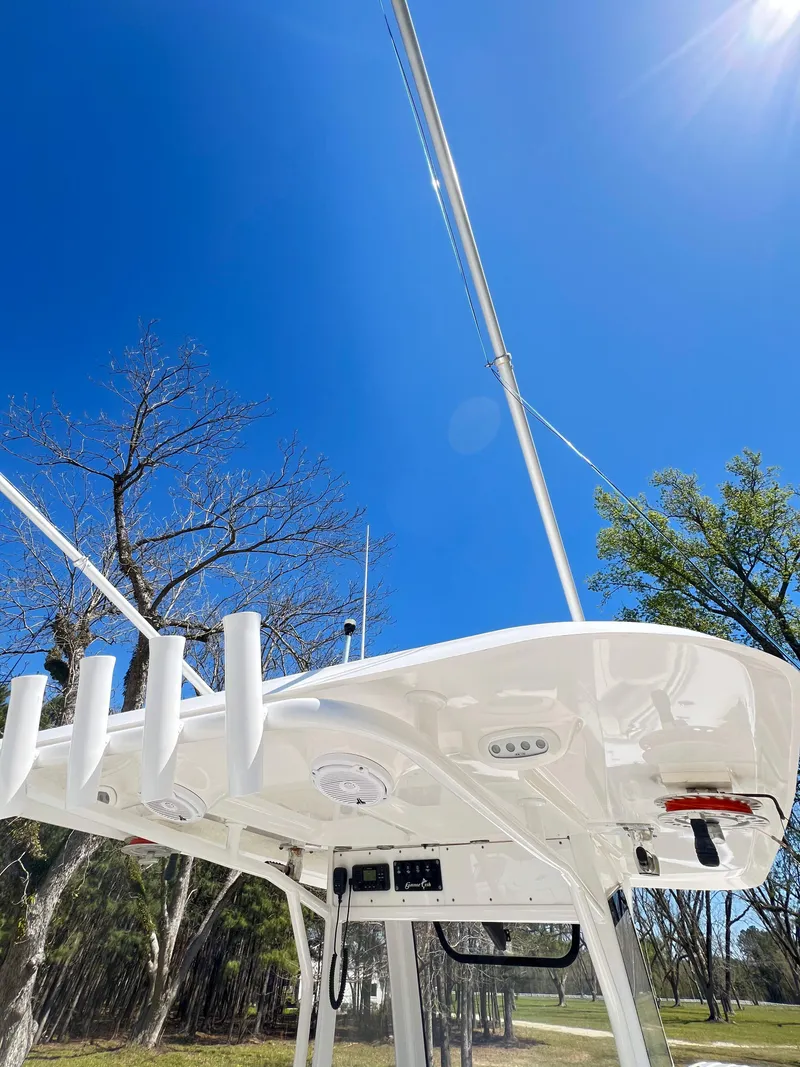 Slide: The Image of 2018 Sea Hunt Gamefish 30 boat top under clear blue sky. - 8