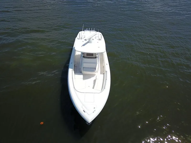 Slide: The Image of 2013 Intrepid 327 Center Console boat on calm water. - 9