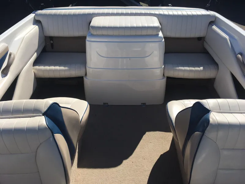 Slide: The Image of Interior of a 1998 Chaparral 200 LE boat with white and blue seating. - 10