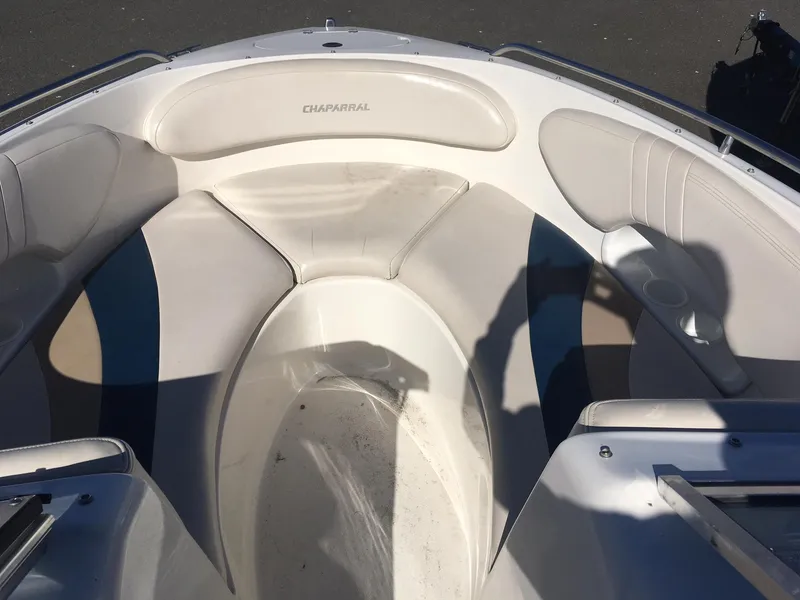 Slide: The Image of 1998 Chaparral 200 LE boat interior with white and gray seating. - 11