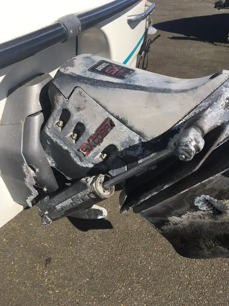 Slide: The Image of 1998 Chaparral 200 LE boat with a weathered outboard motor. - 12