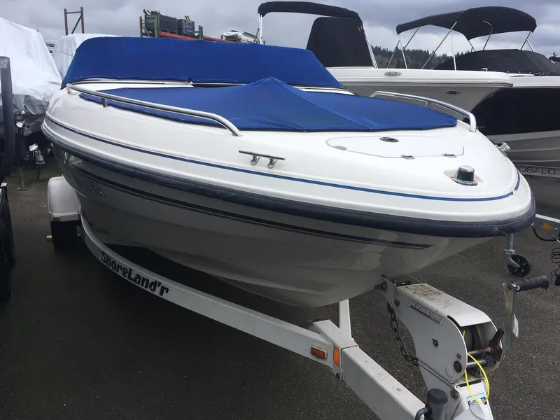 Slide: The Image of 1998 Chaparral 200 LE boat on ShoreLand'r trailer with blue cover. - 3