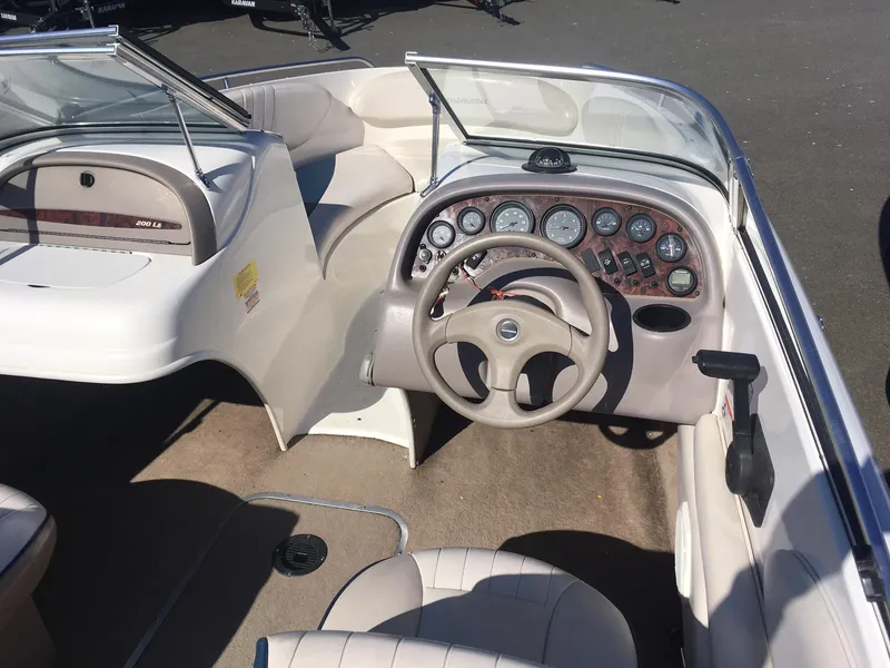Slide: The Image of 1998 Chaparral 200 LE boat interior with steering wheel and dashboard. - 7