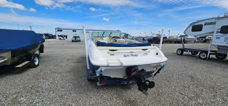 Slide: The Image of 1995 Sea Ray 200 Signature boat in a marina parking lot. - 4