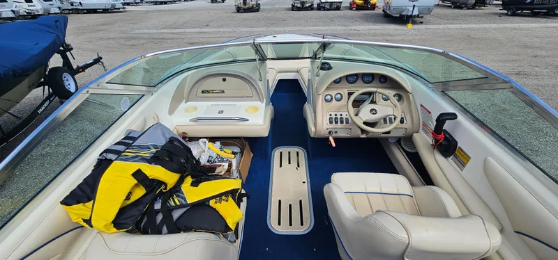 Slide: The Image of 1995 Sea Ray 200 Signature boat interior with steering wheel and life jackets. - 5