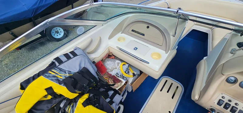 Slide: The Image of 1995 Sea Ray 200 Signature boat interior with life jackets and storage compartment. - 8