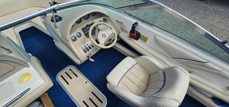 Slide: The Image of 1995 Sea Ray 200 Signature boat interior with steering wheel and dashboard. - 9