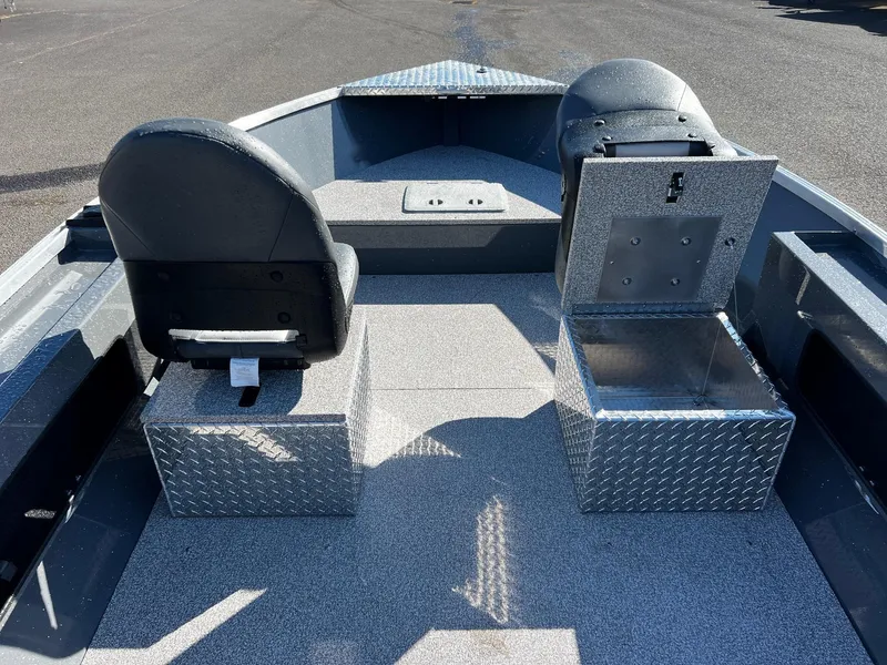 Slide: The Image of 2024 Fish Rite Angler 18 interior with seating and storage compartments. - 11