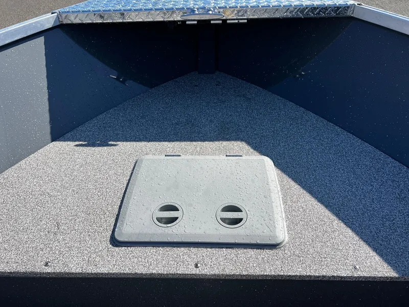 Slide: The Image of 2024 Fish Rite Angler 18 boat interior with storage compartment. - 12