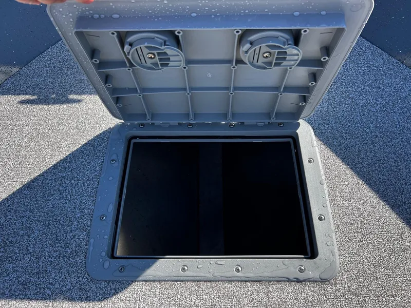Slide: The Image of Open storage compartment on 2024 Fish Rite Angler 18 boat. - 13