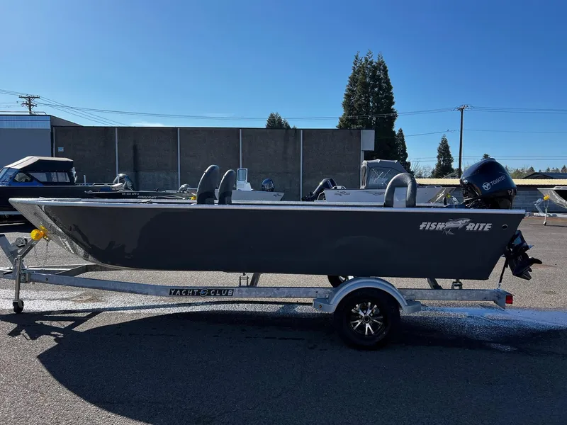 Slide: The Image of 2024 Fish Rite Angler 18 boat on trailer in outdoor lot. - 5