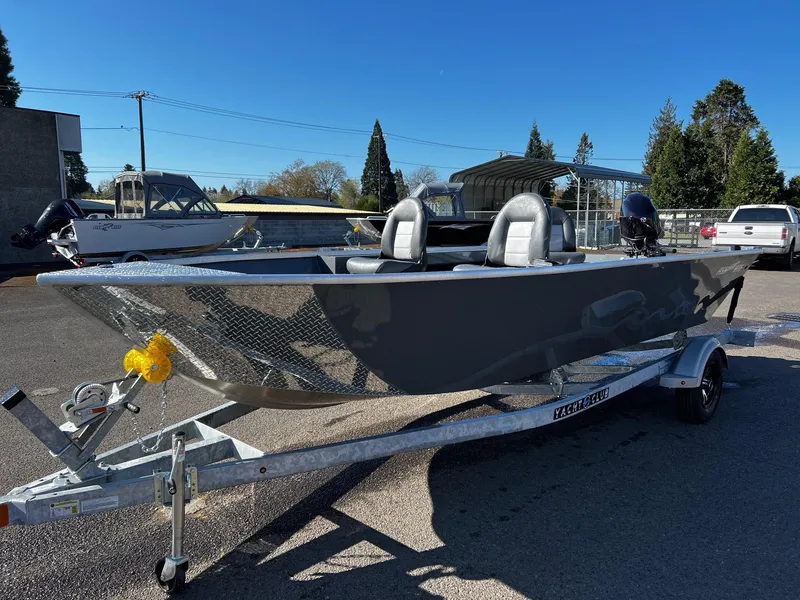 Slide: The Image of 2024 Fish Rite Angler 18 boat on a trailer in a parking lot. - 6