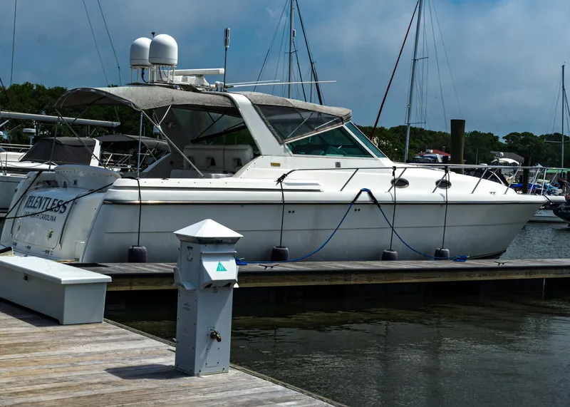 Slide: The Image of 1999 Tiara Yachts 4000 Express docked at a marina. - 0