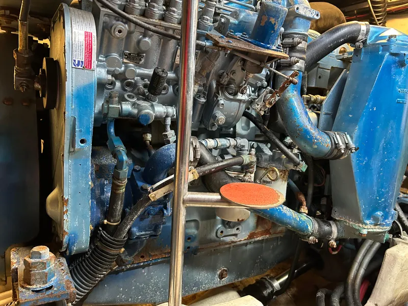Slide: The Image of 1999 Tiara Yachts 4000 Express engine compartment with blue engine components. - 18