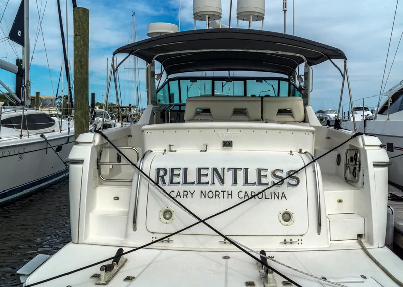Slide: The Image of 1999 Tiara Yachts 4000 Express docked, named Relentless from Cary, North Carolina. - 2