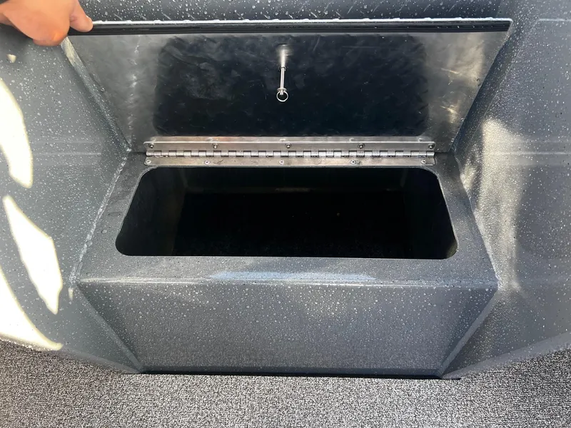 Slide: The Image of Open storage compartment on 2024 Fish Rite 180 Sportsman boat. - 10