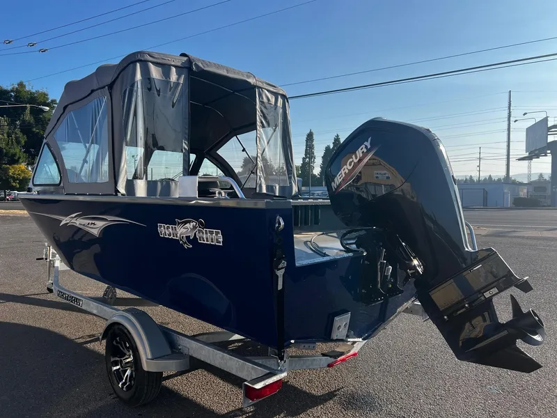 Slide: The Image of 2024 Fish Rite 180 Sportsman boat with Mercury outboard motor on trailer. - 4