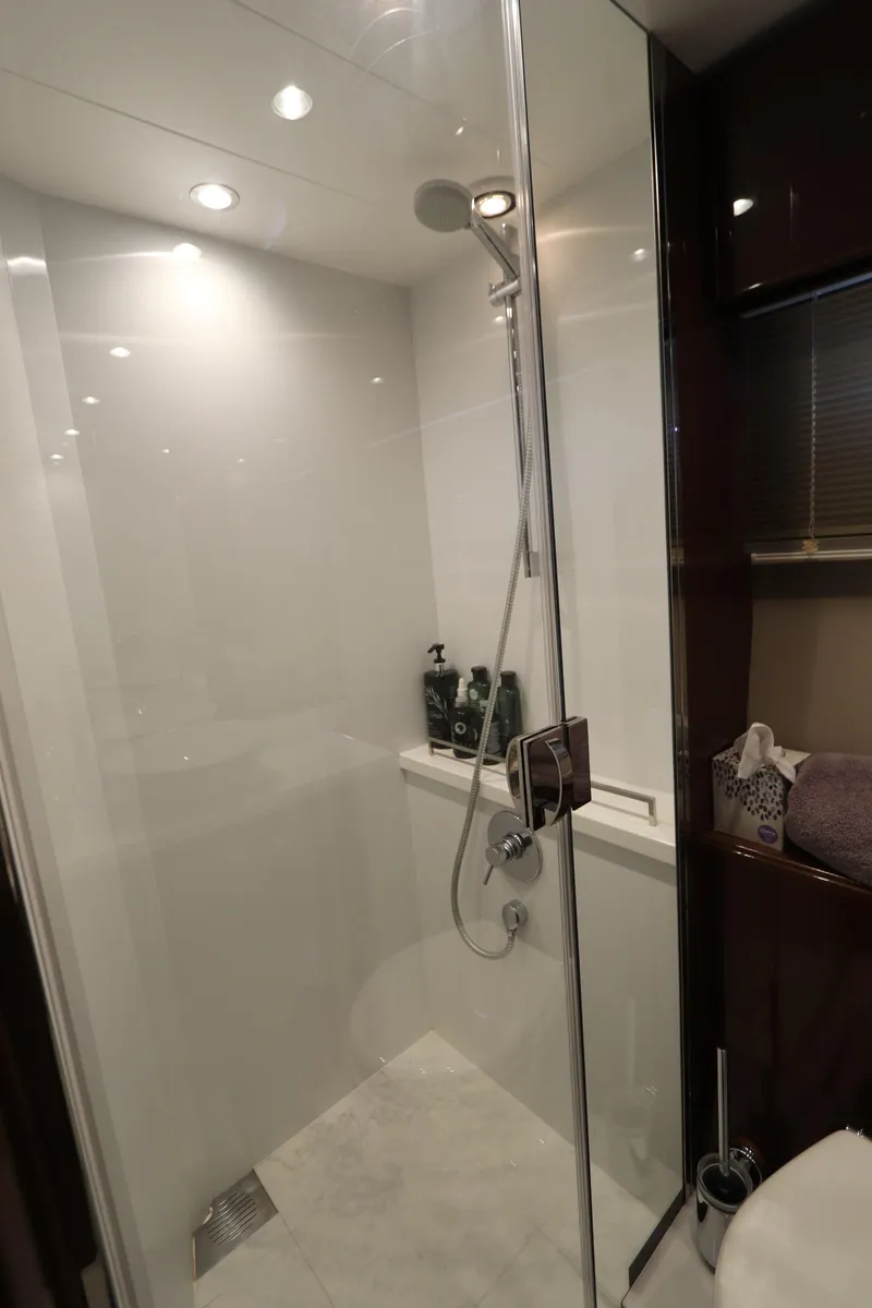Slide: The Image of Luxurious shower in 2018 Princess V58 yacht with modern fixtures and glass enclosure. - 10