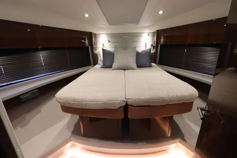 Slide: The Image of Luxurious cabin interior of 2018 Princess V58 yacht with elegant bedding and ambient lighting. - 11