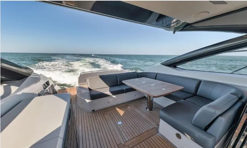 Slide: The Image of Luxurious 2018 Princess V58 yacht with elegant seating and ocean view. - 14