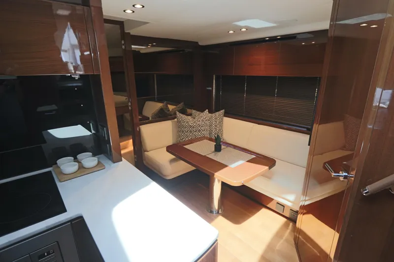 Slide: The Image of Luxurious interior of 2018 Princess V58 yacht with modern dining area and kitchen. - 3