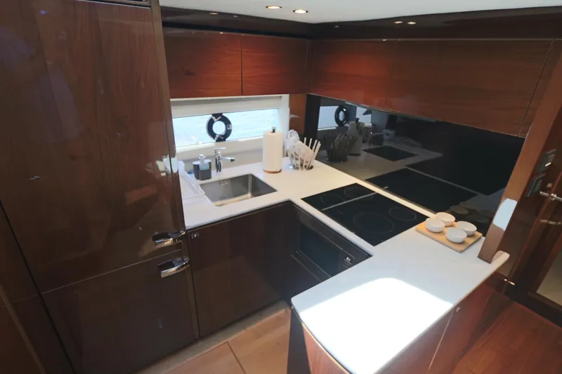 Slide: The Image of Luxurious kitchen interior of 2018 Princess V58 yacht with modern appliances and sleek design. - 4