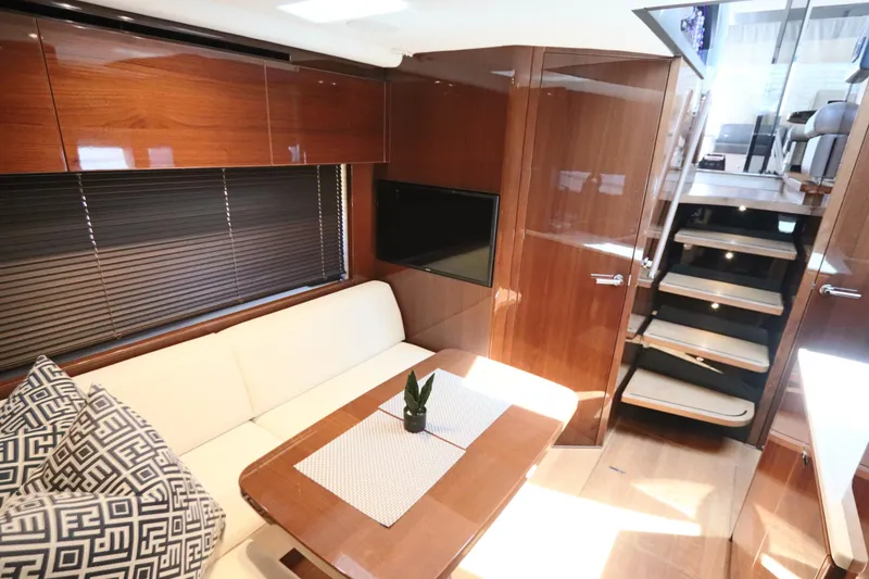 Slide: The Image of Luxurious interior of 2018 Princess V58 yacht with elegant seating and wooden finishes. - 5