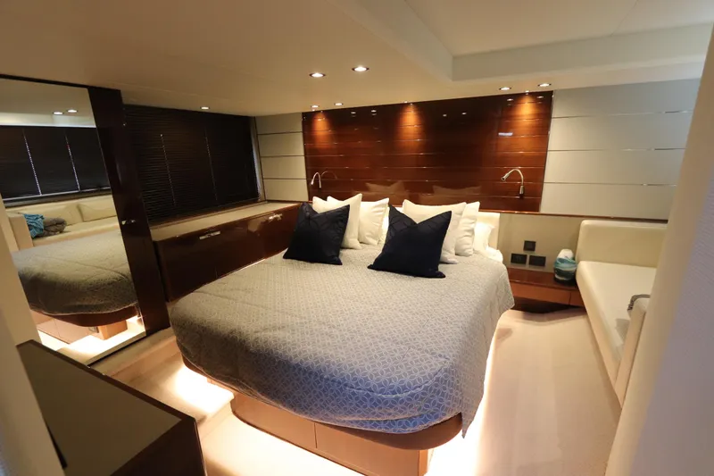 Slide: The Image of Luxurious bedroom interior of 2018 Princess V58 yacht with modern design and ambient lighting. - 6