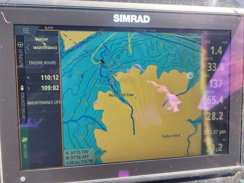 Slide: The Image of Simrad navigation display on 2021 Cruisers Yachts 38 GLS I/O showing West Beach Cove. - 2