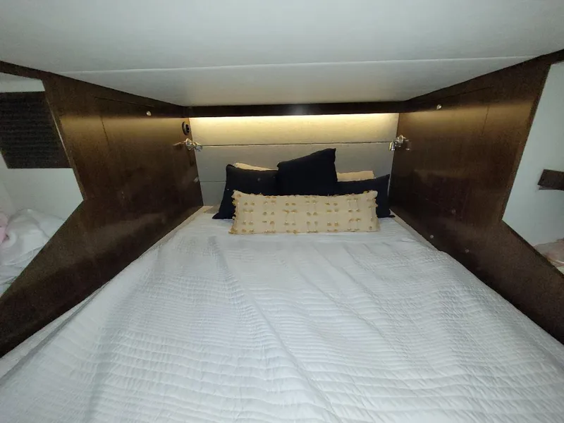 Slide: The Image of 2021 Cruisers Yachts 38 GLS I/O cabin interior with cozy bed and pillows. - 20