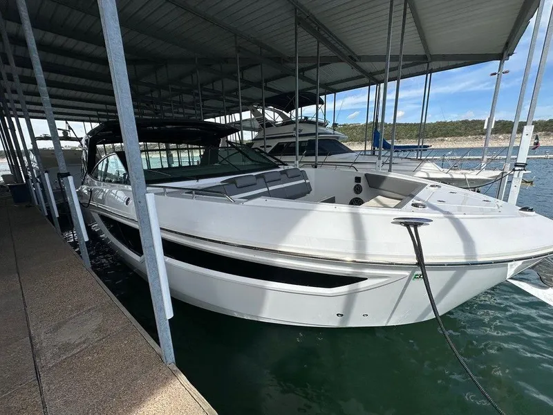 Slide: The Image of 2021 Cruisers Yachts 38 GLS I/O docked in a covered marina. - 3