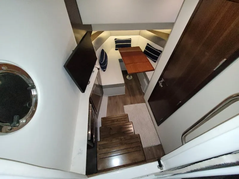 Slide: The Image of Interior of 2021 Cruisers Yachts 38 GLS I/O with seating and TV. - 32