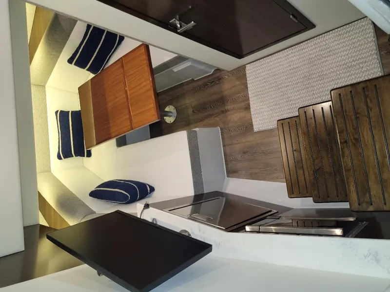 Slide: The Image of Interior of 2021 Cruisers Yachts 38 GLS I/O with seating and wooden table. - 33