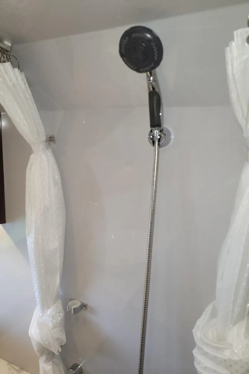 Slide: The Image of Shower area in 2021 Cruisers Yachts 38 GLS I/O boat, featuring modern fixtures. - 35