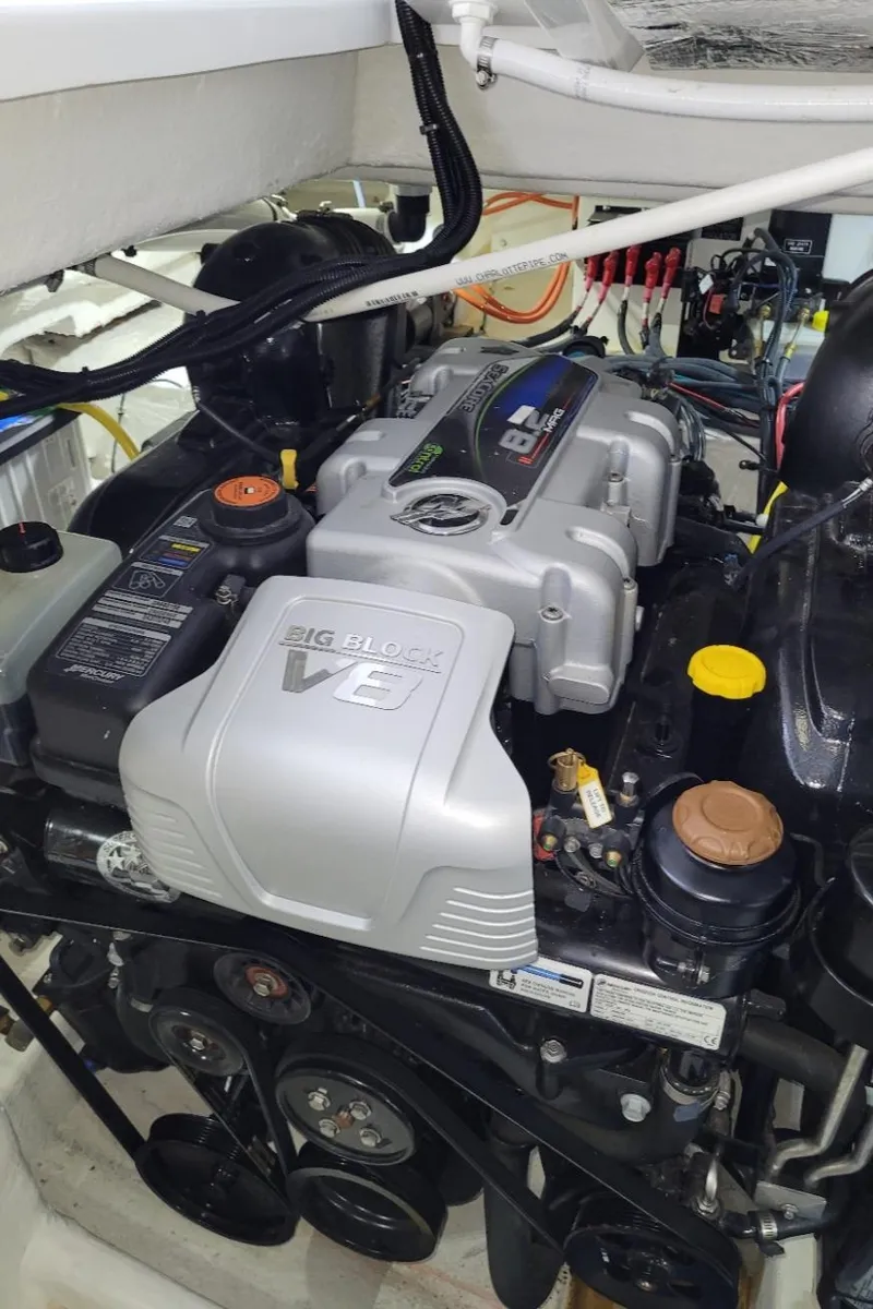 Slide: The Image of Engine compartment of a 2021 Cruisers Yachts 38 GLS I/O, featuring a powerful V8 engine. - 36