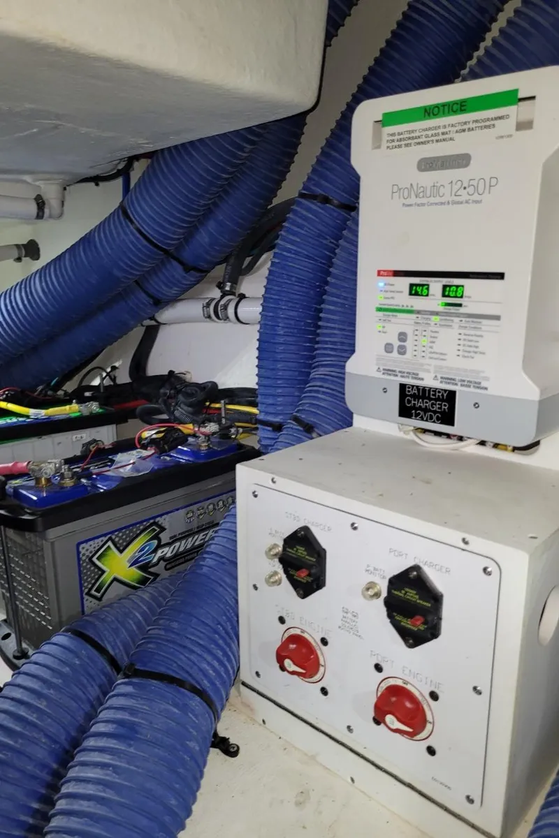 Slide: The Image of Engine room of 2021 Cruisers Yachts 38 GLS I/O with battery and electrical systems. - 38