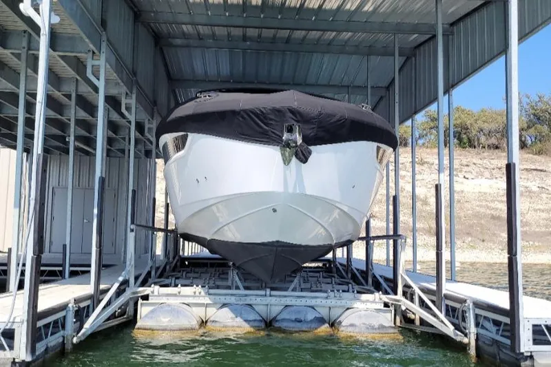 Slide: The Image of 2021 Cruisers Yachts 38 GLS I/O docked in a covered marina. - 40