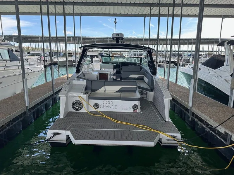 Slide: The Image of 2021 Cruisers Yachts 38 GLS I/O docked in a marina. - 6