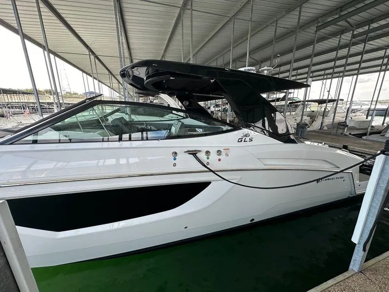 Slide: The Image of 2021 Cruisers Yachts 38 GLS I/O in a covered marina slip. - 7