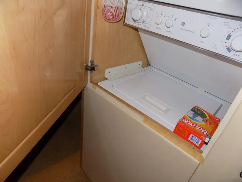 Slide: The Image of Laundry area in 1997 Hatteras 50 Convertible yacht with washer and dryer. - 34