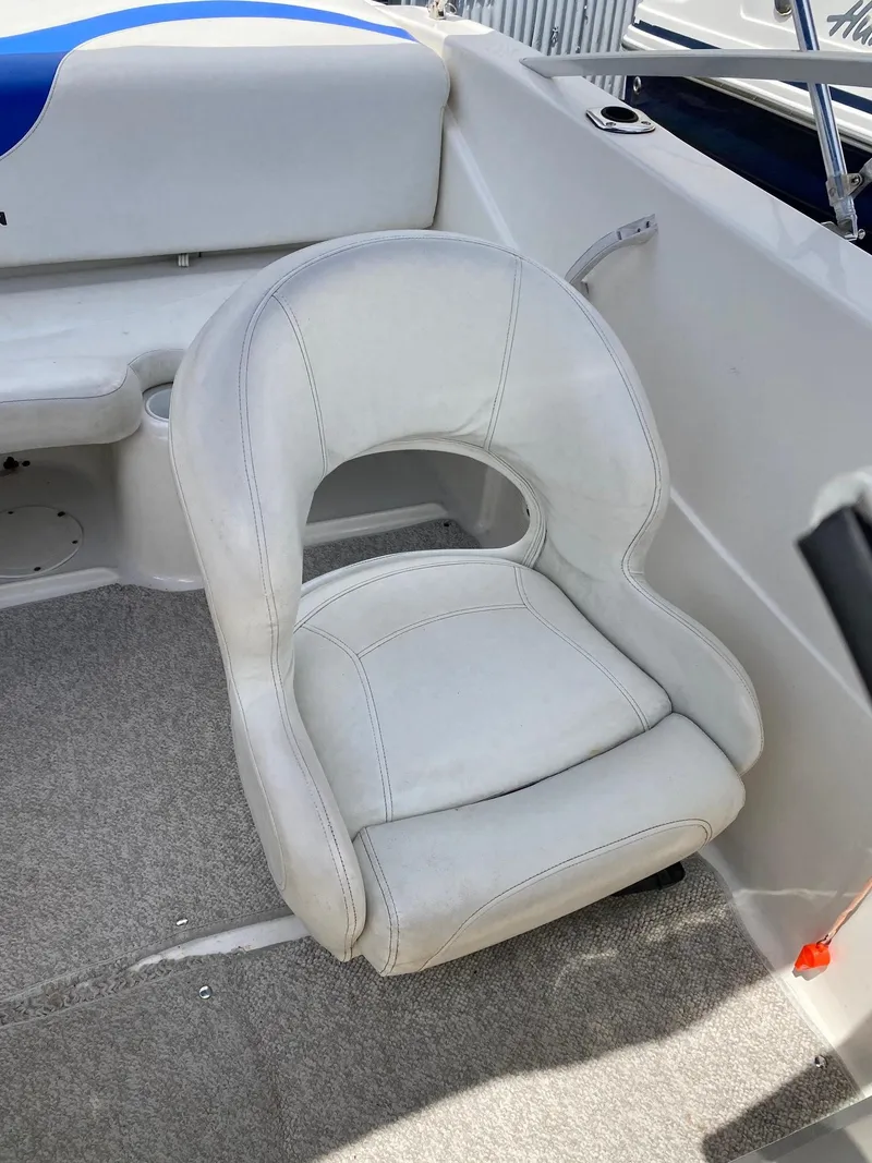Slide: The Image of 2008 Glastron 175 MX boat interior with white cushioned seat. - 12