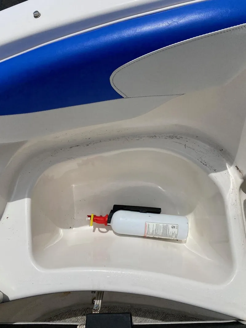 Slide: The Image of Fire extinguisher in storage compartment of 2008 Glastron 175 MX boat. - 18