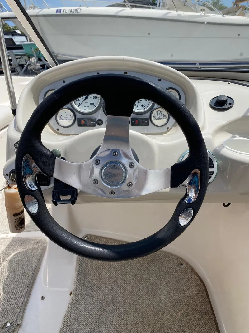 Slide: The Image of Steering wheel and dashboard of a 2008 Glastron 175 MX boat. - 6