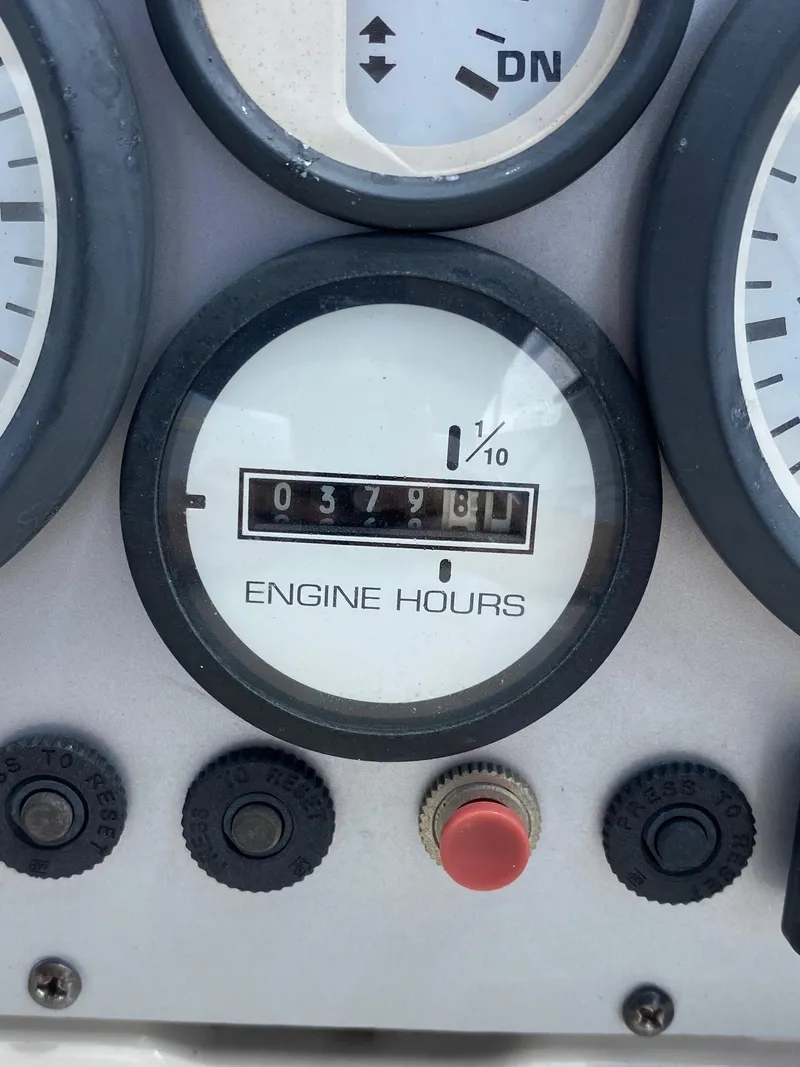 Slide: The Image of Close-up of 2008 Glastron 175 MX boat engine hours gauge showing 379.8 hours. - 8